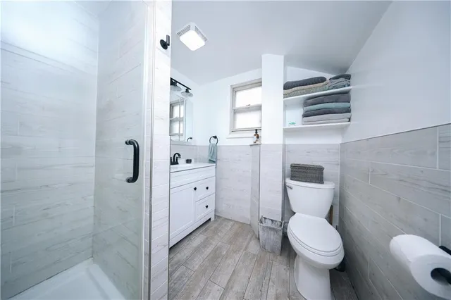 a view of a balcony with couch and wooden floor