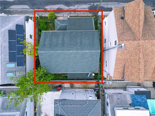 a aerial view of a house with a yard
