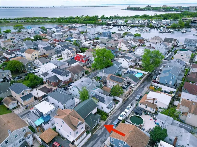 a bedroom with furniture and a flat screen tv