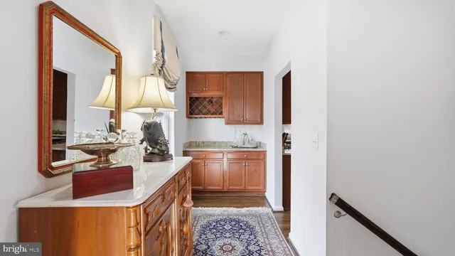 a kitchen with a sink and a stove top oven