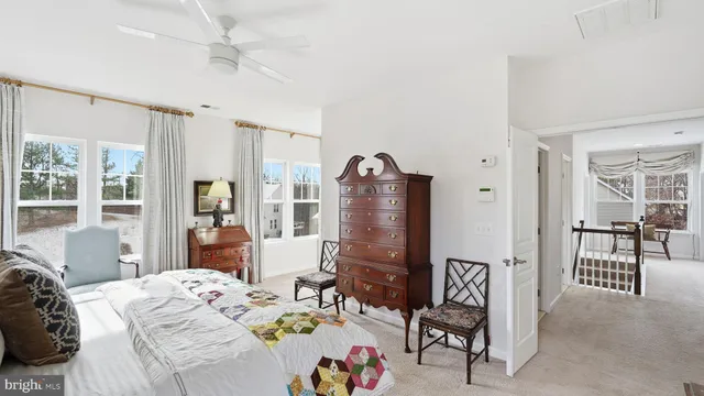 a bed room with a bed and a chair