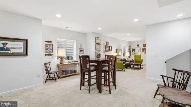 a view of a dining room with furniture and a livingroom