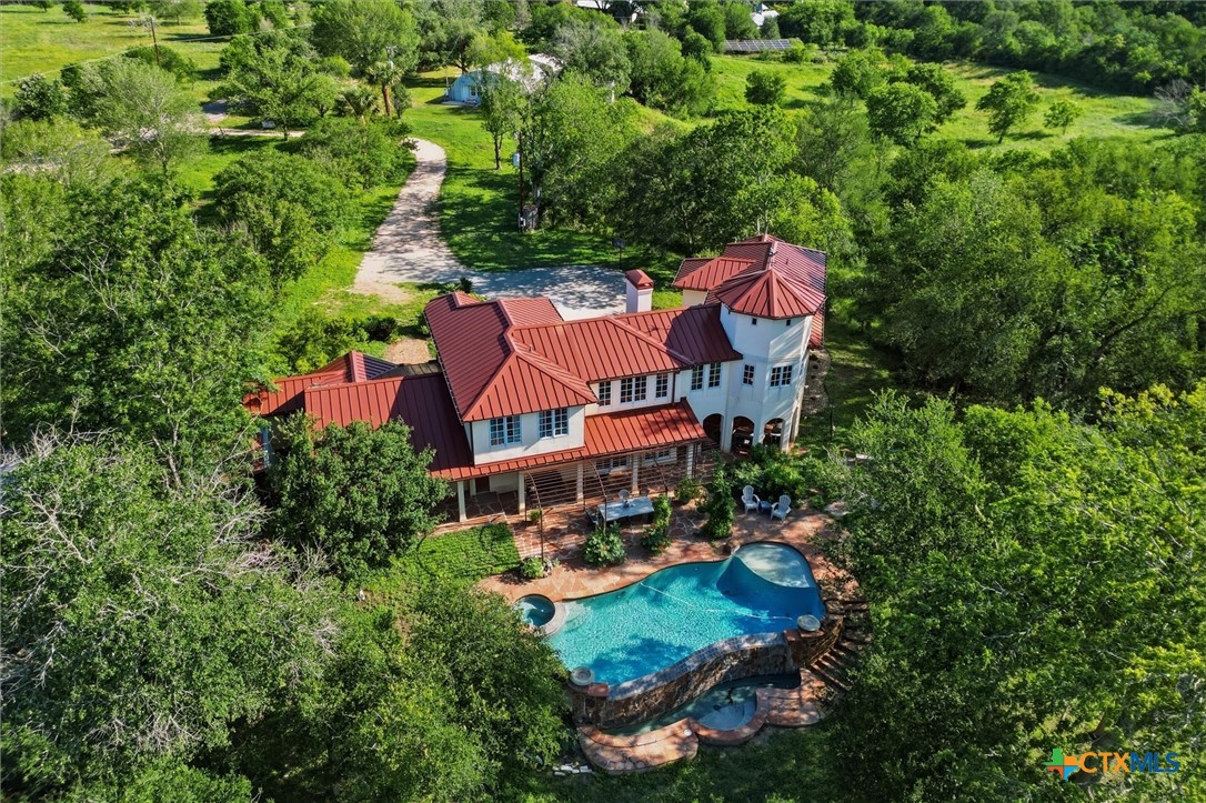 541 Martindale Falls Road Martindale, TX 78655 - Photo 38 of 44 Aerial view of custom riverfront estate with resort-style pool and wooded privacy