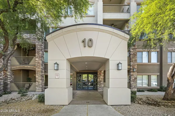 a front view of a house with garage