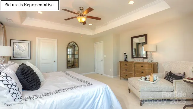 a bedroom with a bed and ceiling fan