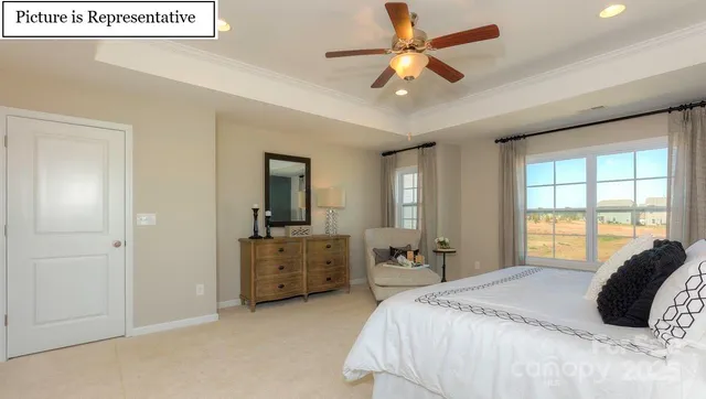 a bed room with a bed and a television