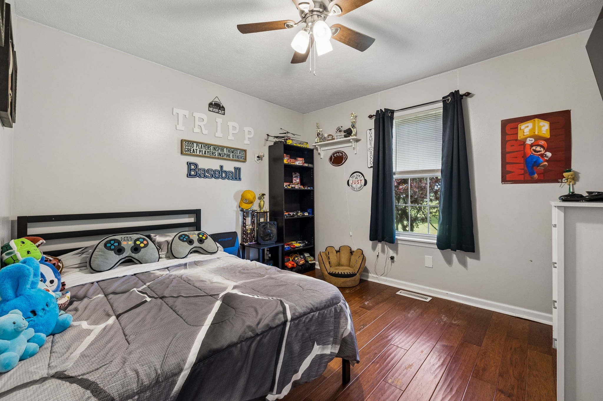 2075 Nikki Drive Springfield, TN 37172 - Photo 25 of 58 a bedroom with a bed and wooden floor