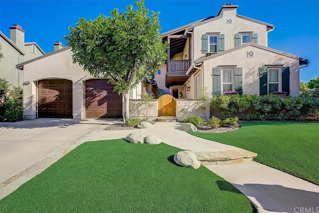 258 Spruce Circle Simi Valley, CA 93065 - Photo 1 of 1 a front view of a house with a yard and garage
