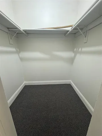 a view of an empty walk in closet