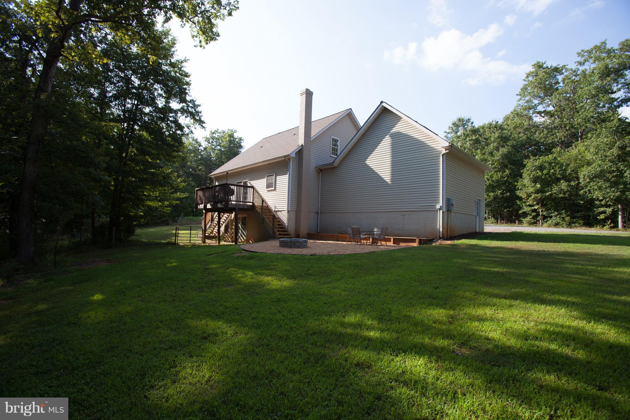 32020 Russel Road Locust Grove, VA 22508 - Photo 17 of 23 Deck and firepit overlooking pond