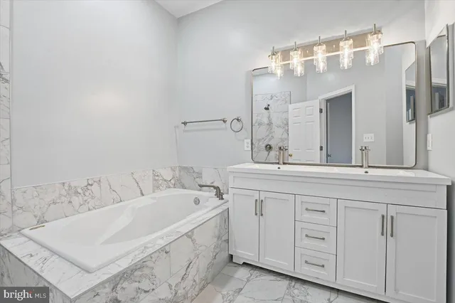 a bath room with a sink and a mirror
