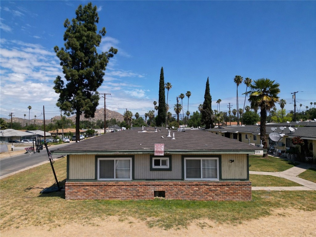 1195 Spring Street Riverside, CA 92507 - Photo 2 of 5 a front view of a house with a yard