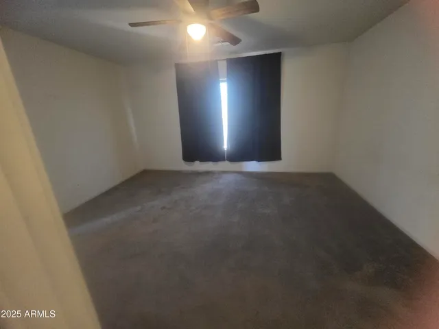 a view of an empty room with an entryway