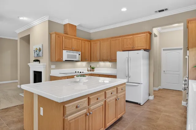 a view of room with a ceiling fan and window