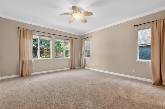 a front view of a house with garden and porch