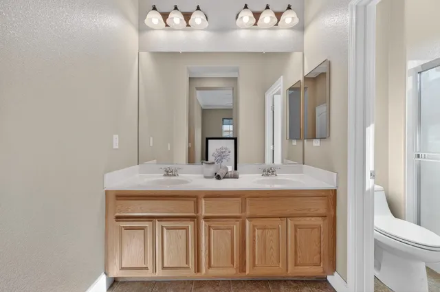 an aerial view of a residential apartment building with a yard