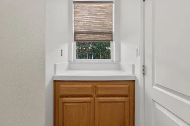 a room with pool table table soccer and windows