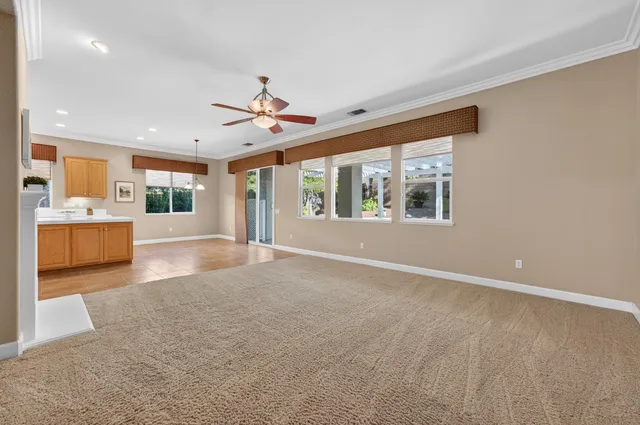 a kitchen with stainless steel appliances granite countertop a refrigerator sink and cabinets