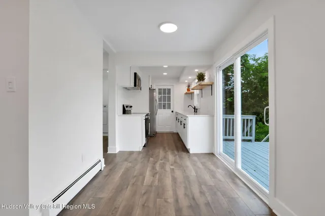 a view of a kitchen with a stove top oven