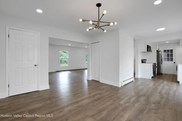 a view of a livingroom with wooden floor