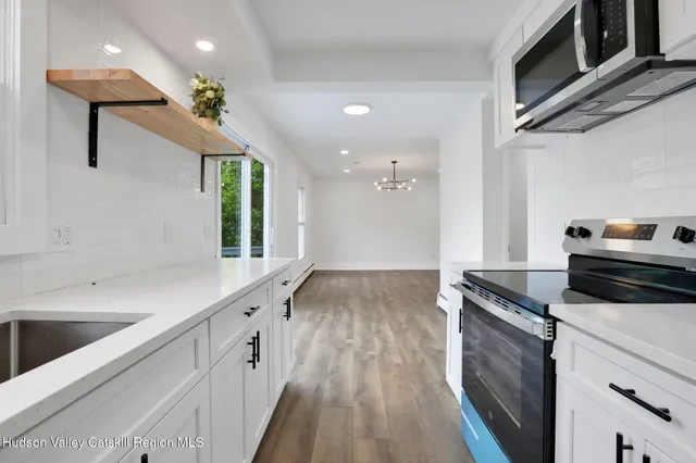 a kitchen with a stove and a sink