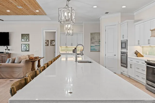 a living room with furniture a window and a dining table