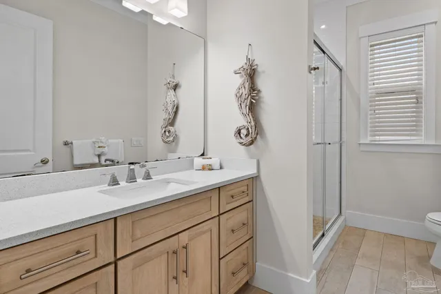 a bedroom with bed and window