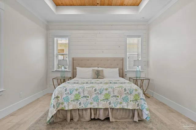 a bedroom with bed and glass door