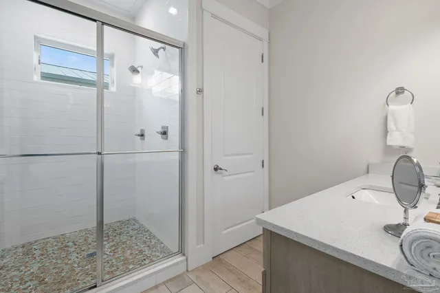 a bathroom with a sink toilet and shower