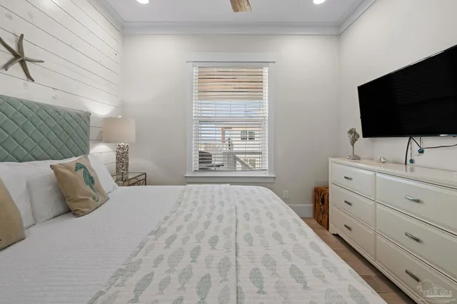 a bedroom with furniture and flat screen tv