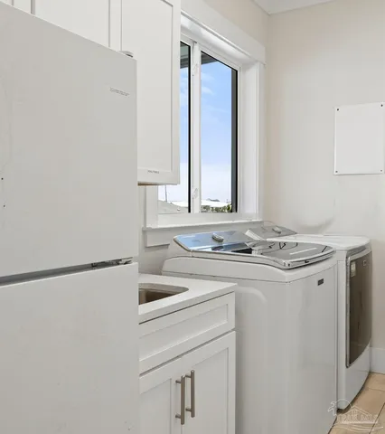 a view of a patio with table and chairs a barbeque with wooden floor and fence