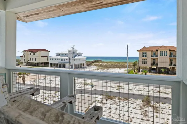a view of a patio with wooden floor
