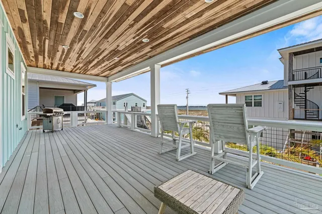 a view of swimming pool with outdoor seating