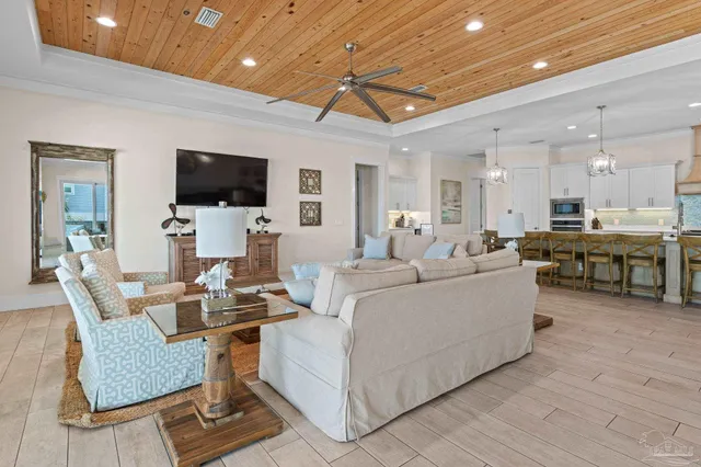 a kitchen with stainless steel appliances kitchen island granite countertop a dining table and chairs