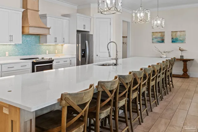 a large kitchen with cabinets a sink and a stove