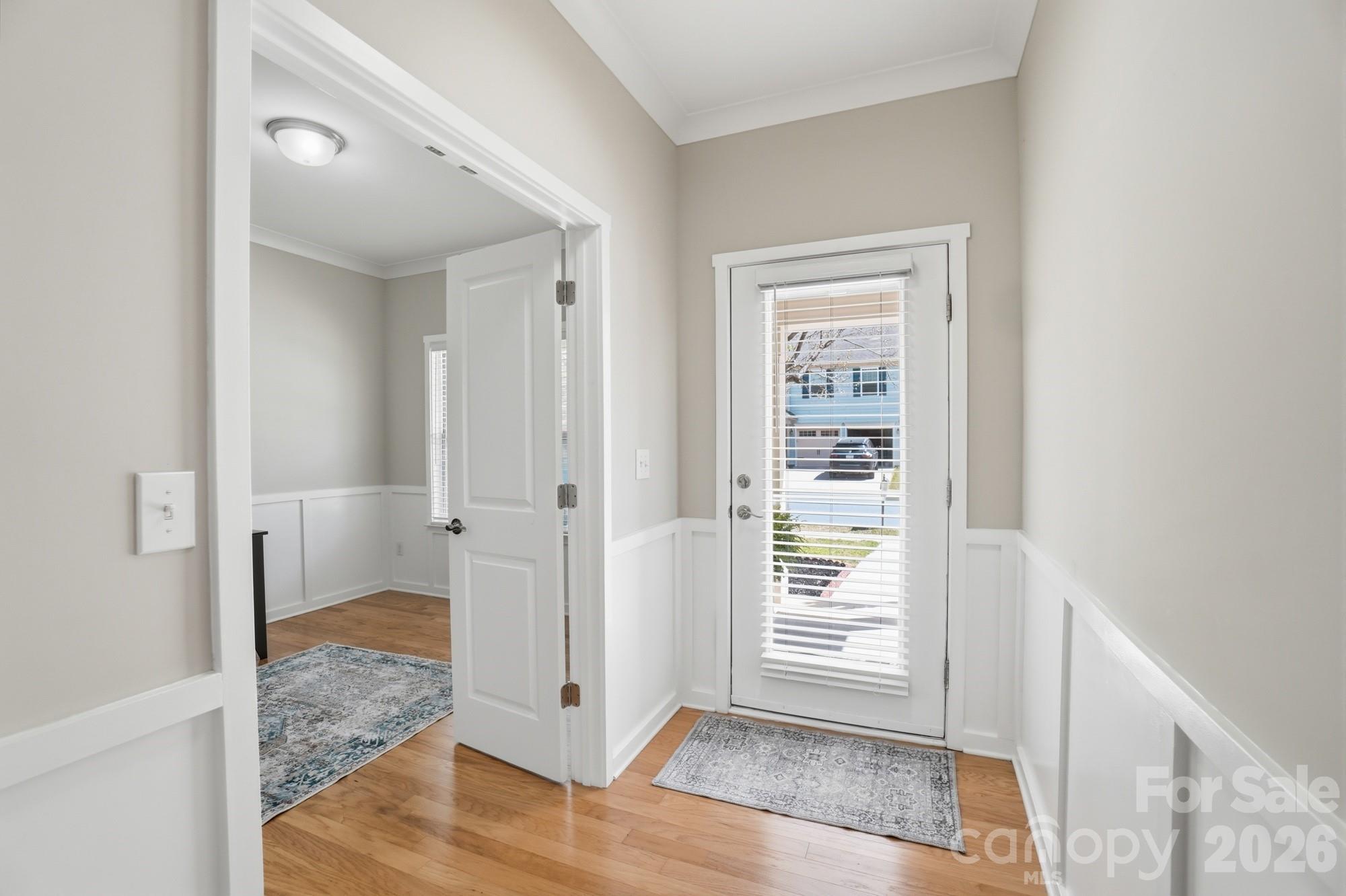 2153 Bluebell Way Tega Cay, SC 29708 - Photo 6 of 48 a view of a hallway with wooden floor and closet