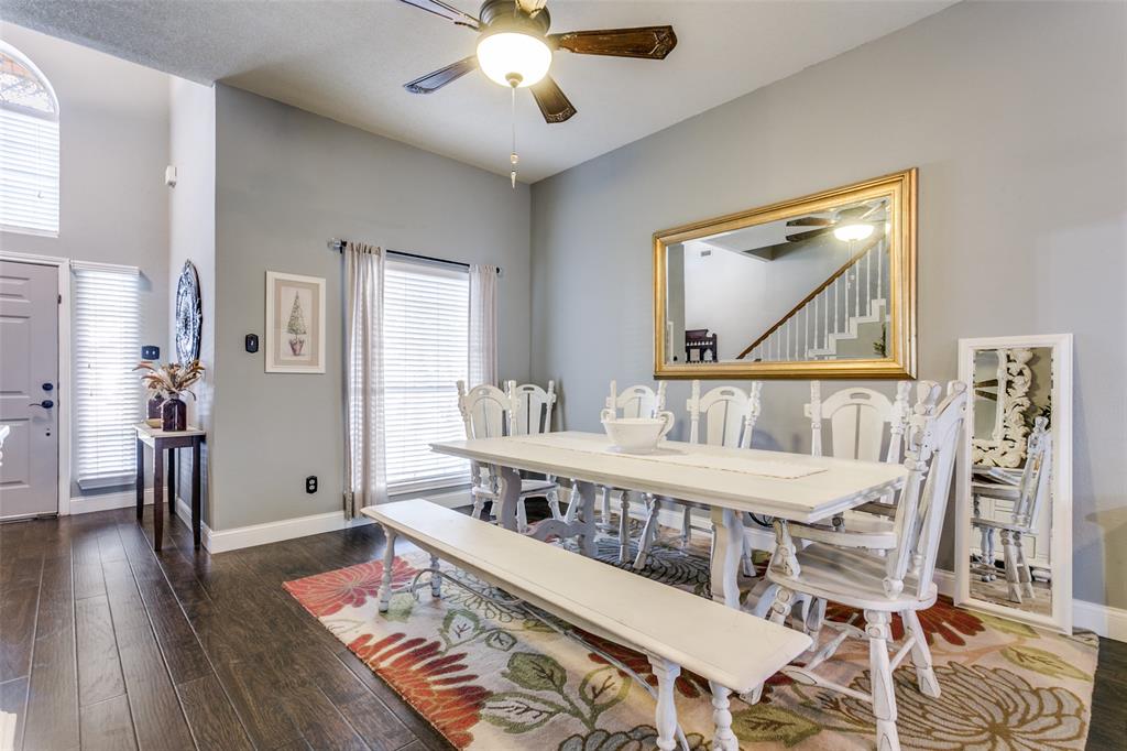 2133 Rim Rock Drive Keller, TX 76248 - Photo 6 of 37 Dining space featuring dark wood-style flooring, ceiling fan, and stairs