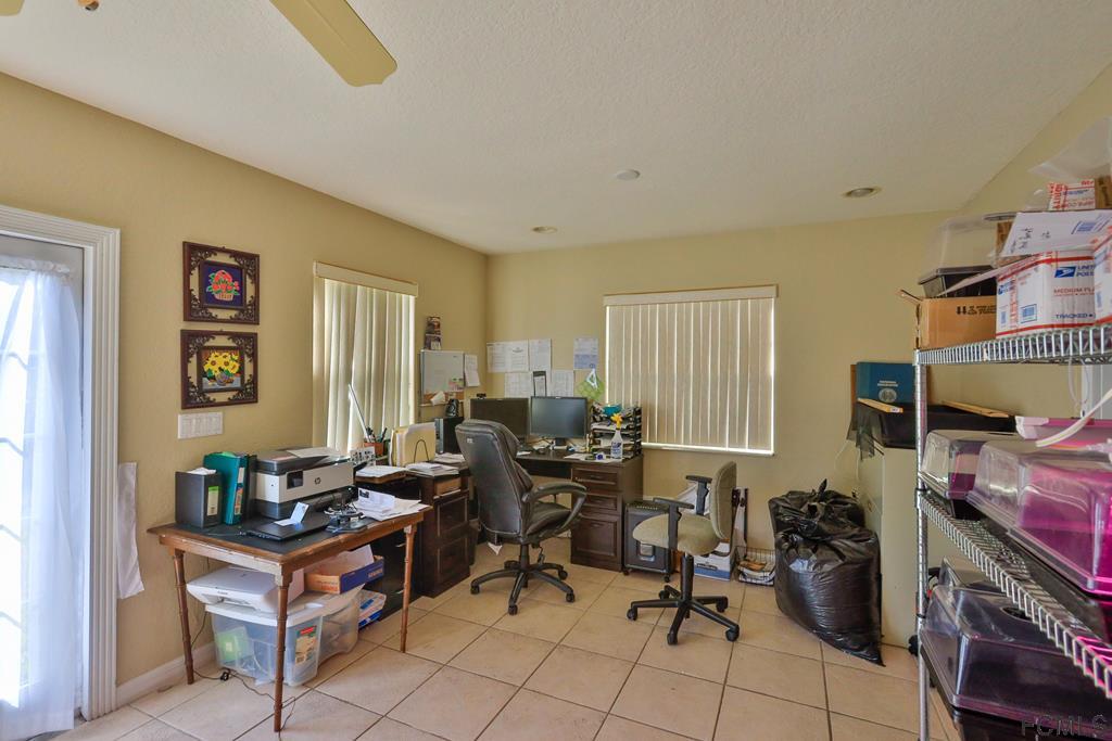 37 Raintree Place Palm Coast, FL 32164 - Photo 9 of 24 enclosed Florida room