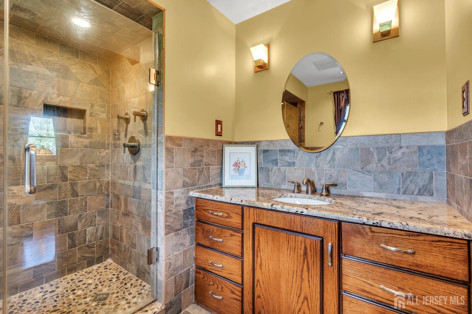 99 Schulmeister Road Old Bridge, NJ 08857 - Photo 27 of 49 a bathroom with a sink and a mirror