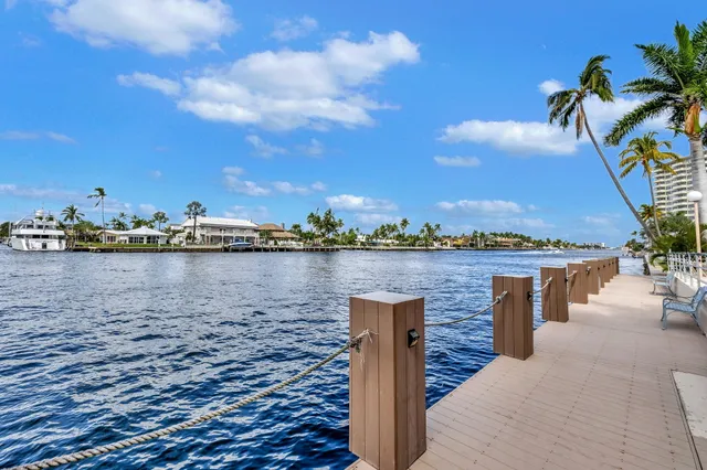 a building outdoor space with patio furniture and potted plants