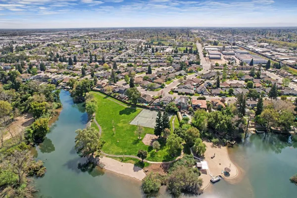 an aerial view of lake residential houses with outdoor space and river