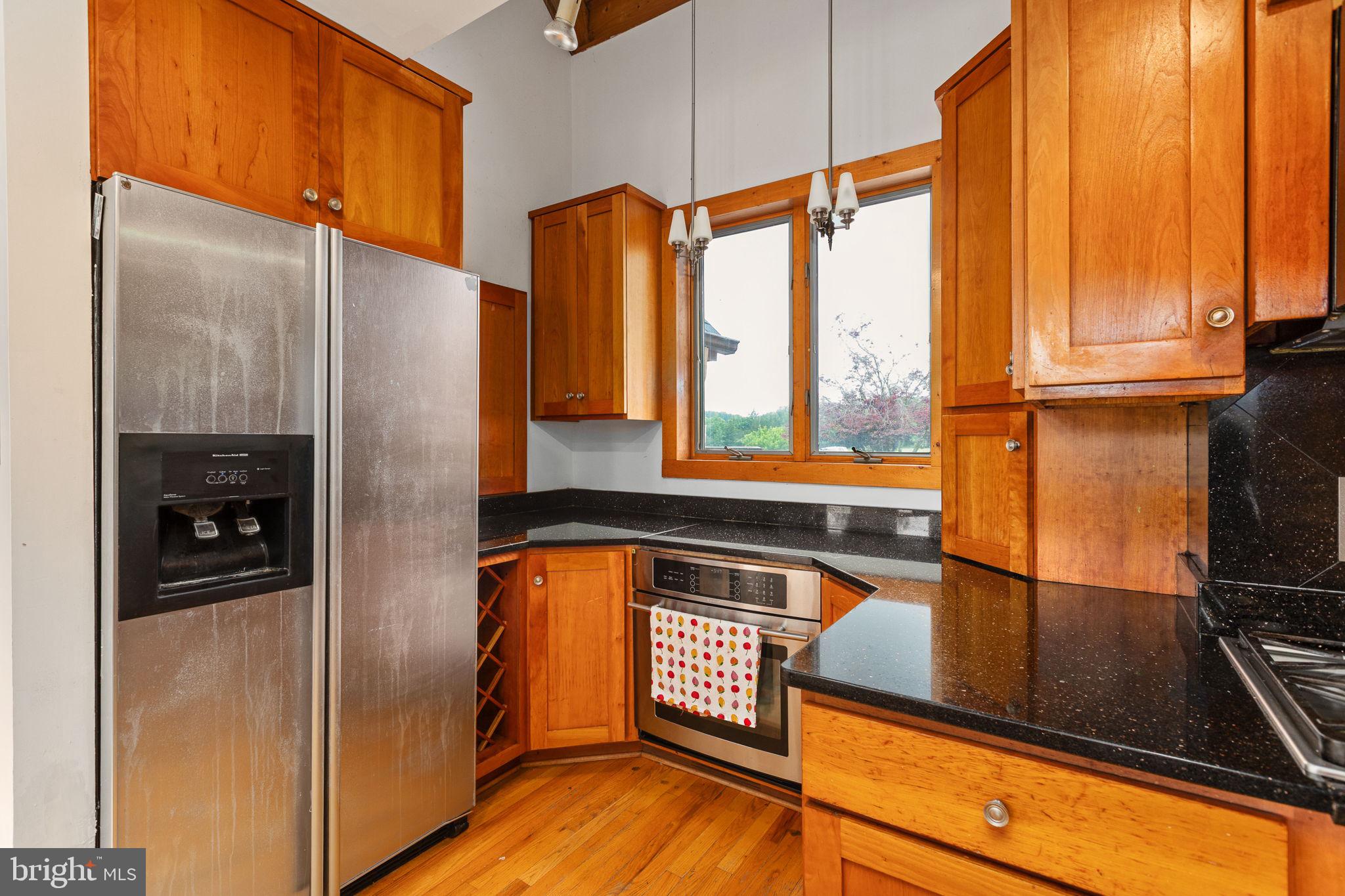 6119 Beach Road Midland, VA 22728 - Photo 40 of 98 a kitchen with stainless steel appliances granite countertop a refrigerator and a sink