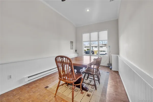 a view of a dining room with furniture and window