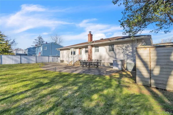 a view of swimming pool with outdoor seating and plants