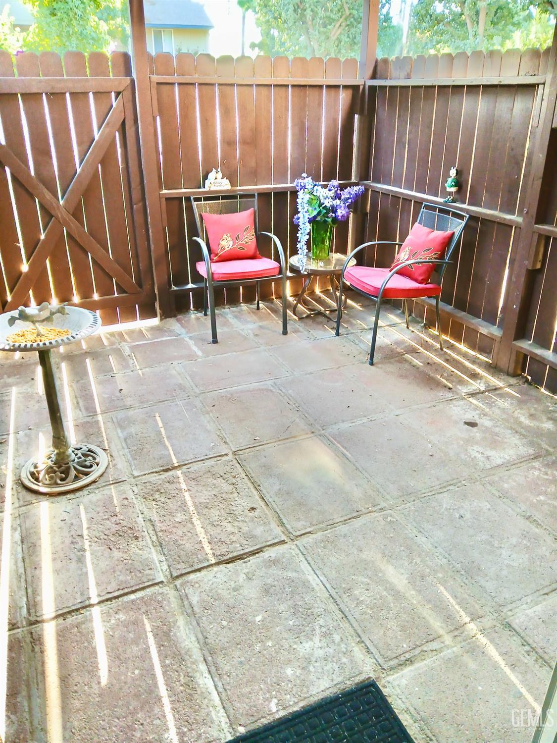 Undisclosed Address Bakersfield, CA 93309 - Photo 13 of 15 a backyard with table and chairs