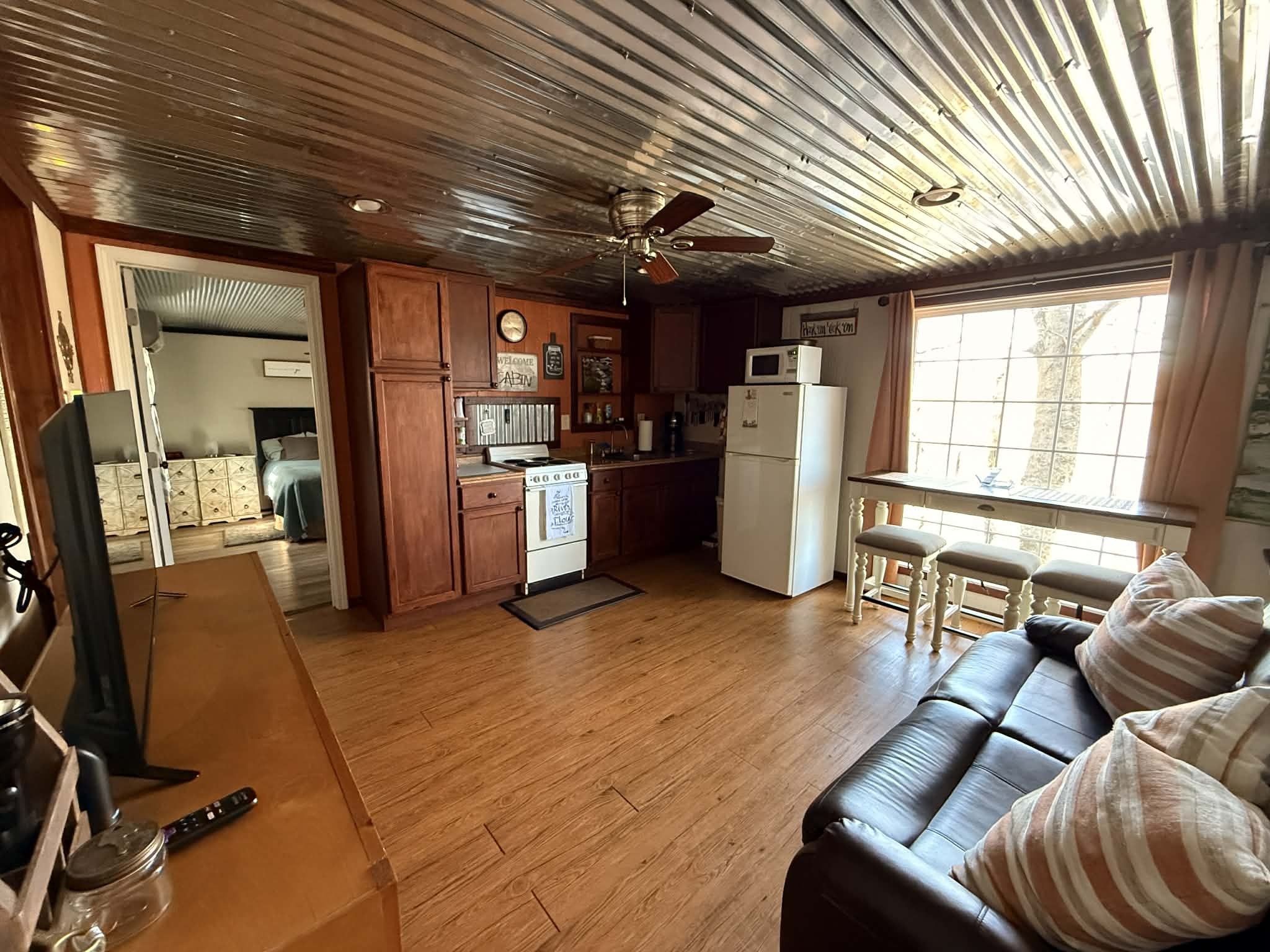 18531 Bream Bluff Athens, AL 35611 - Photo 15 of 41 a living room with furniture a flat screen tv and next to a window
