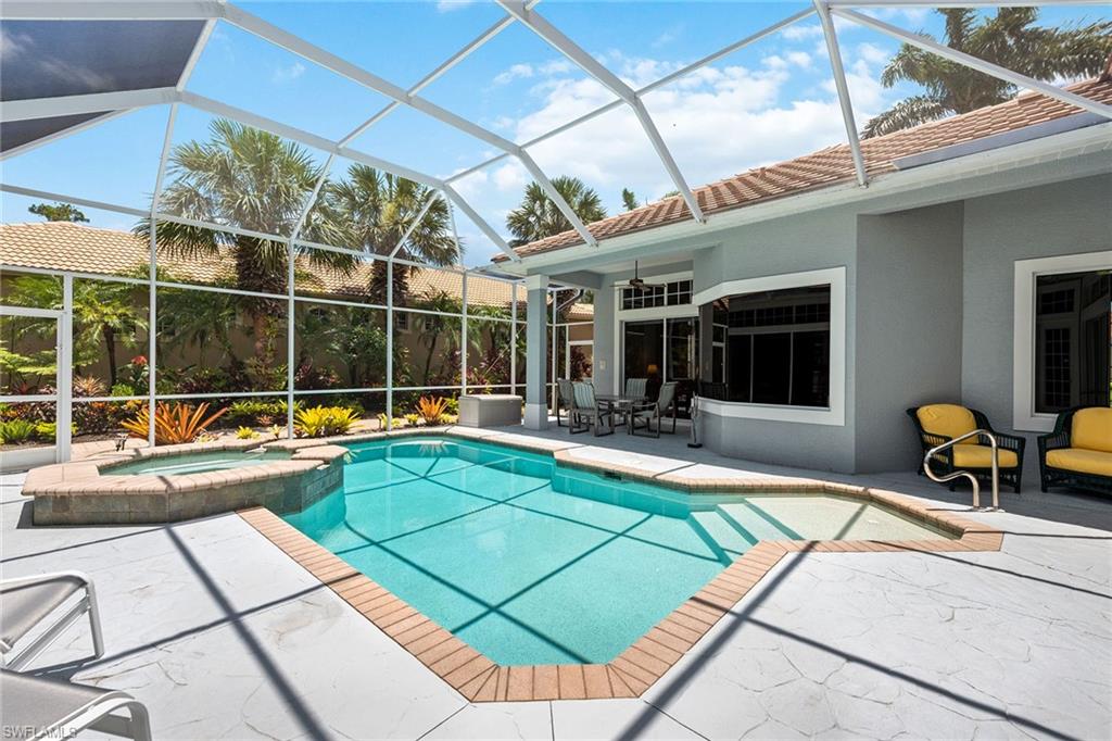 566 Eagle Creek Drive Naples, FL 34113 - Photo 19 of 25 a view of swimming pool with chairs
