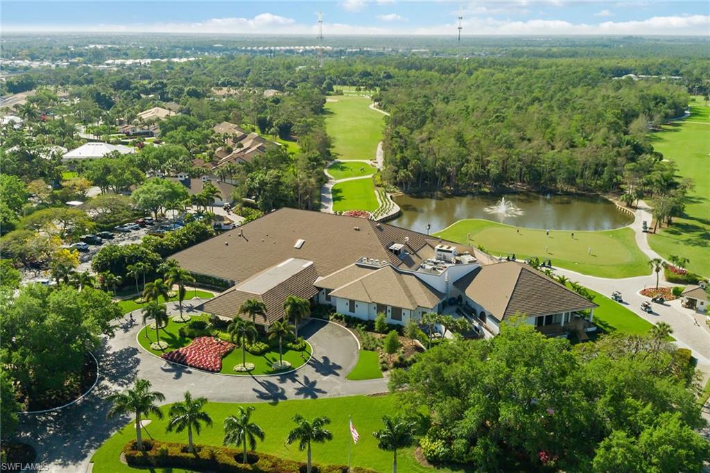 566 Eagle Creek Drive Naples, FL 34113 - Photo 20 of 25 an aerial view of a house with a garden and lake view