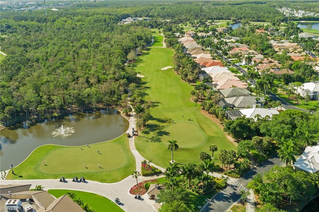 566 Eagle Creek Drive Naples, FL 34113 - Photo 21 of 25 a view of a swimming pool