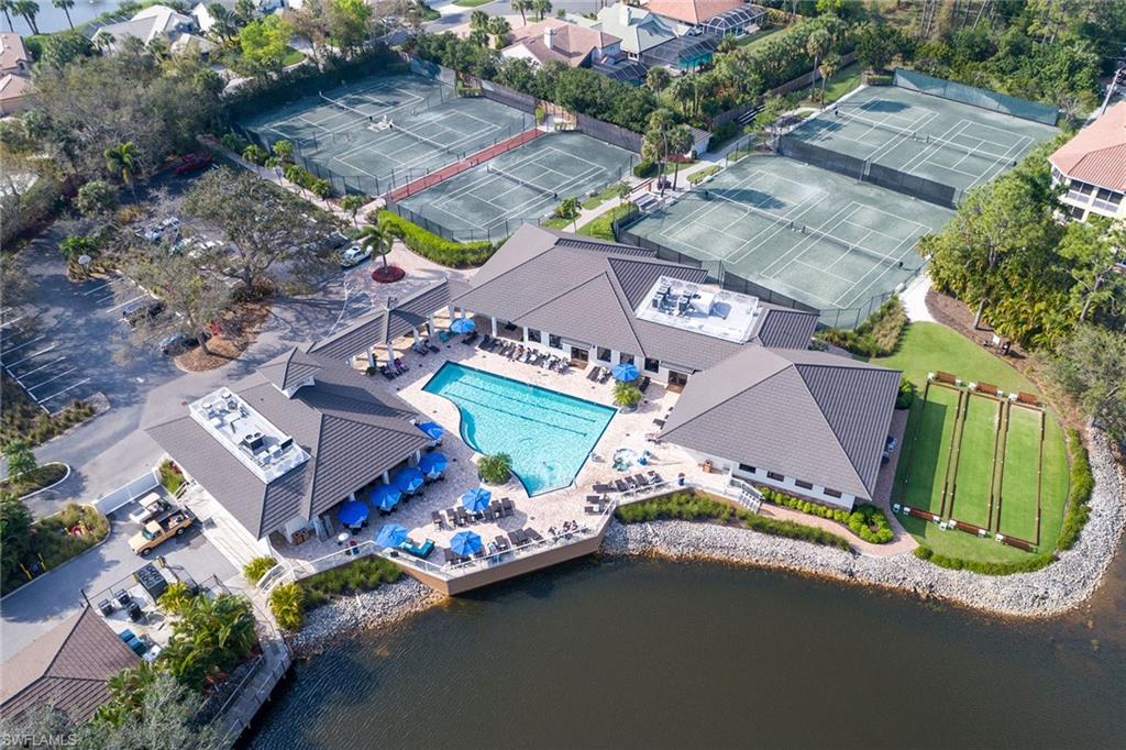 566 Eagle Creek Drive Naples, FL 34113 - Photo 23 of 25 an aerial view of a house with a garden and swimming pool